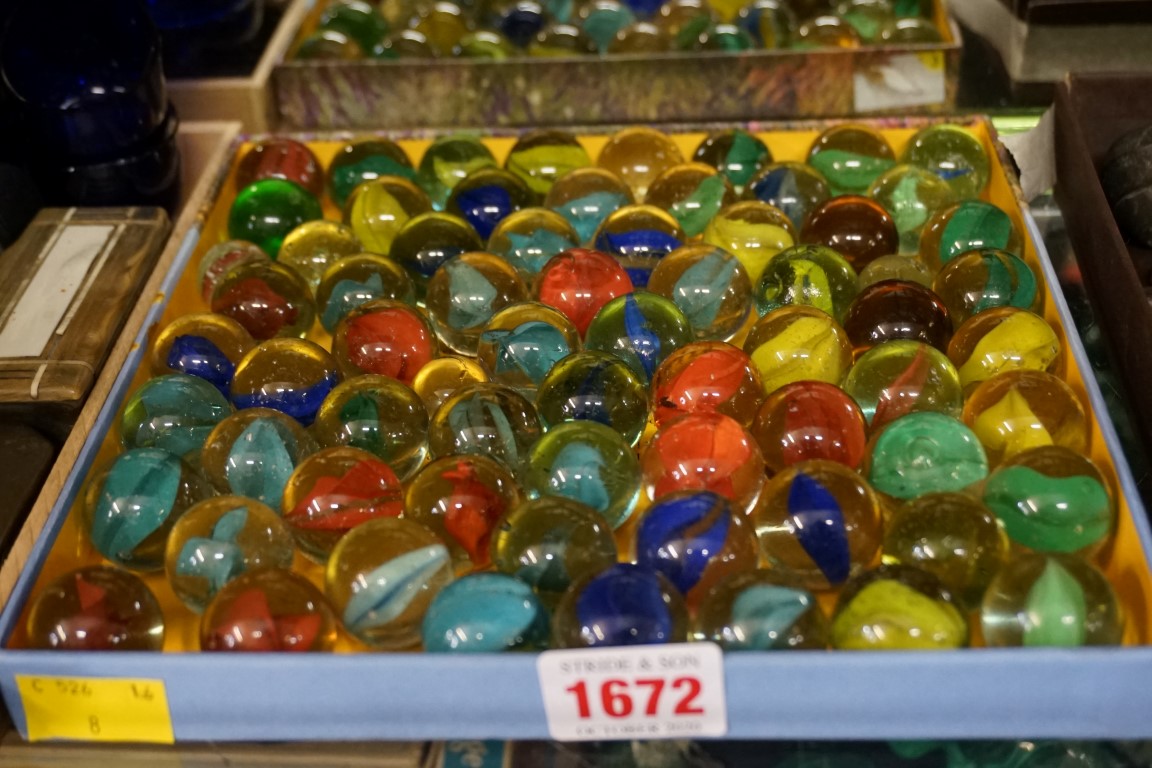 A collection of antique glass marbles.