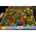 A collection of antique glass marbles.