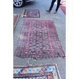 A Persian rug, having repeated design to central field, with geometric borders, 166 x 116cm.