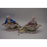 A pair of 19th century Meissen porcelain figural sweetmeat dishes, 26cm wide, possibly outside