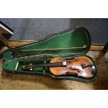 An antique Continental violin, labelled 'Nicolaus Amatus...', with 14in two piece back, with two