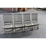 A set of four teak garden chairs. This lot can only be collected on Saturday 10th October. (10-2pm)