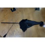 A small folding rosewood and black silk parasol, 70cm long.