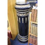 A large 19th century ebonized and gilt gesso pedestal, 105cm wide.