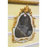An antique carved giltwood framed wall mirror, 50 x 37cm.