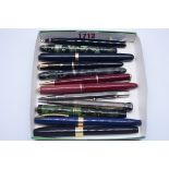 A small collection of vintage pens, to include four with 14ct nibs; another with Parker 18K nib, (