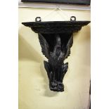 A late 19th century carved and stained oak 'Minories Eagle and Serpent' wall bracket, 49 x 43cm.