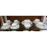 A Shelley 'Archway of Roses' pattern part tea service, in the Queen Anne shape, comprising: sandwich