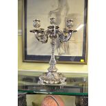 A good antique electroplated four branch candelabrum, 38cm high.