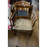 A 19th century fruitwood and rush seated Sussex chair, (s.d.).