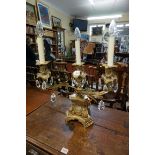 An antique cast and gilt brass three light table lamp, 43cm wide.