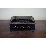 A tortoiseshell, silver mounted and inlaid casket, 13cm wide.
