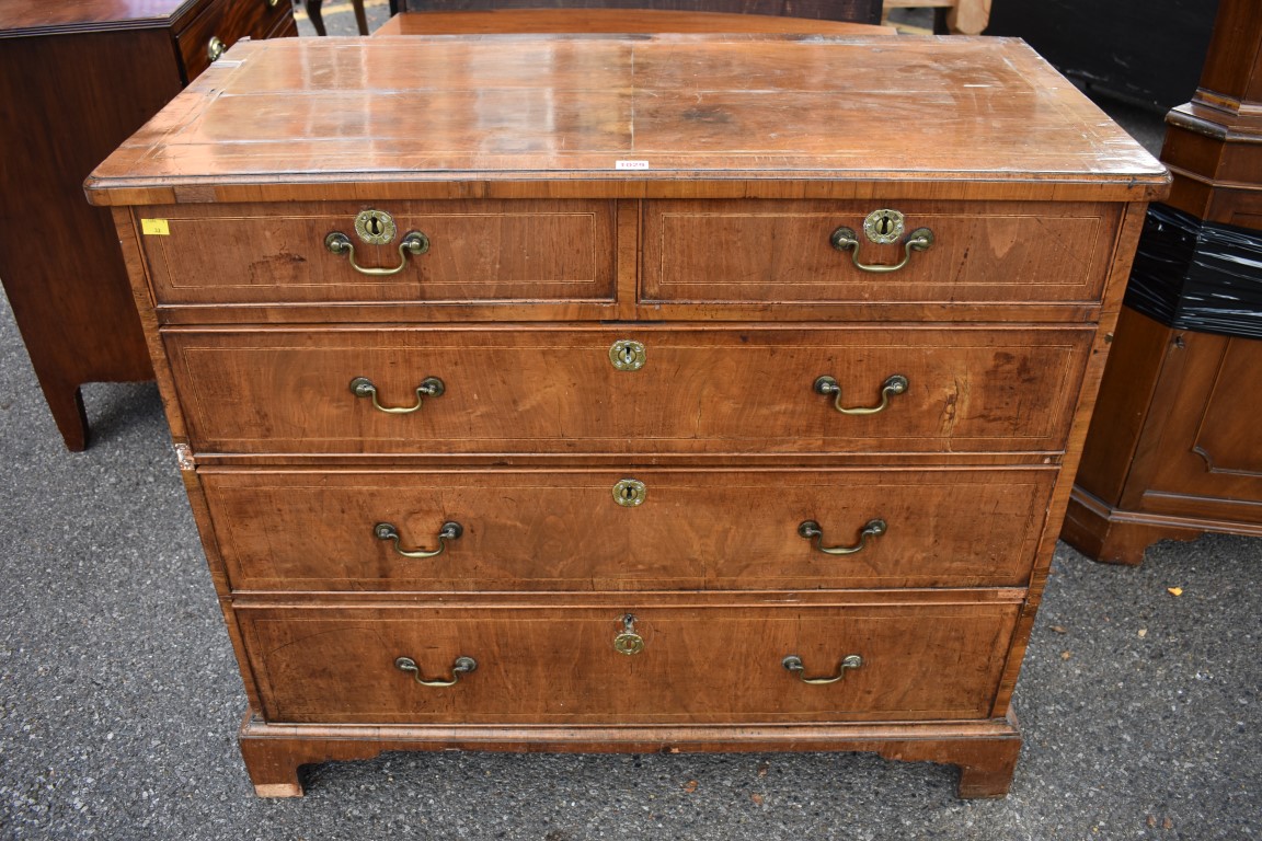 An 18th century walnut and inlaid chest of drawers, 108cm wide. This lot can only be collected on S