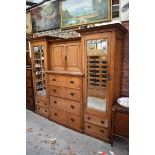 A large circa 1900 oak compactum style wardrobe, 229cm wide.