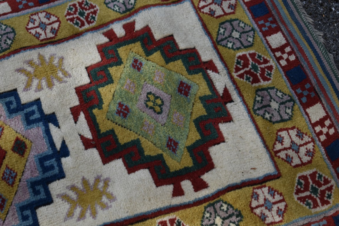 A Caucasian runner, having six central medallions, with geometric borders, 220 x 74cm. - Image 3 of 4