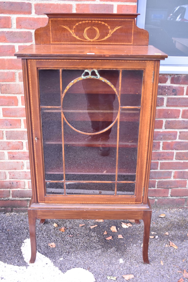 An Edwardian pier cabinet, having raised inlaid top, 66.5cm wide. This lot can only be collected