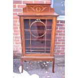 An Edwardian pier cabinet, having raised inlaid top, 66.5cm wide. This lot can only be collected