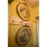 A pair of gilt gesso framed oval prints, the whole 73 x 73cm.
