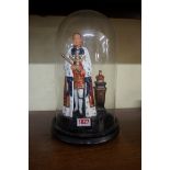 A polychrome painted cast metal figure of Edward VIII, 21cm high, with ebonized wood stand and glass