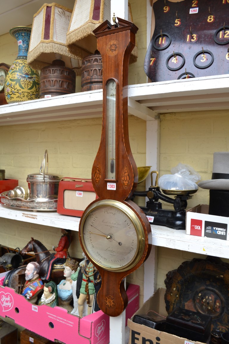 A 19th century mahogany and inlaid banjo barometer, the silvered dial inscribed 'Minola, 39 Leath