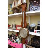 A 19th century mahogany and inlaid banjo barometer, the silvered dial inscribed 'Minola, 39 Leath