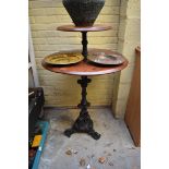 A cast iron two tier bar table, 75cm diameter.