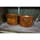 Two George III mahogany and inlaid oval tea caddies, 14.5cm wide.