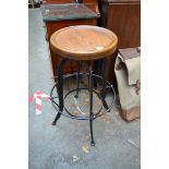 A steel and oak adjustable stool.