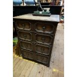 A 1920s oak chest of drawers, 60cm wide.