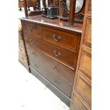 An Edwardian mahogany and satinwood banded chest of drawers, 97.5cm wide.