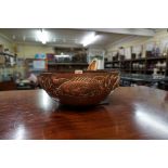 A Newlyn Arts and Crafts hammered copper circular bowl, in the manner of John Pearson, decorated