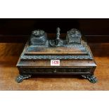 An early 19th century rosewood and brass desk stand, 32cm wide.