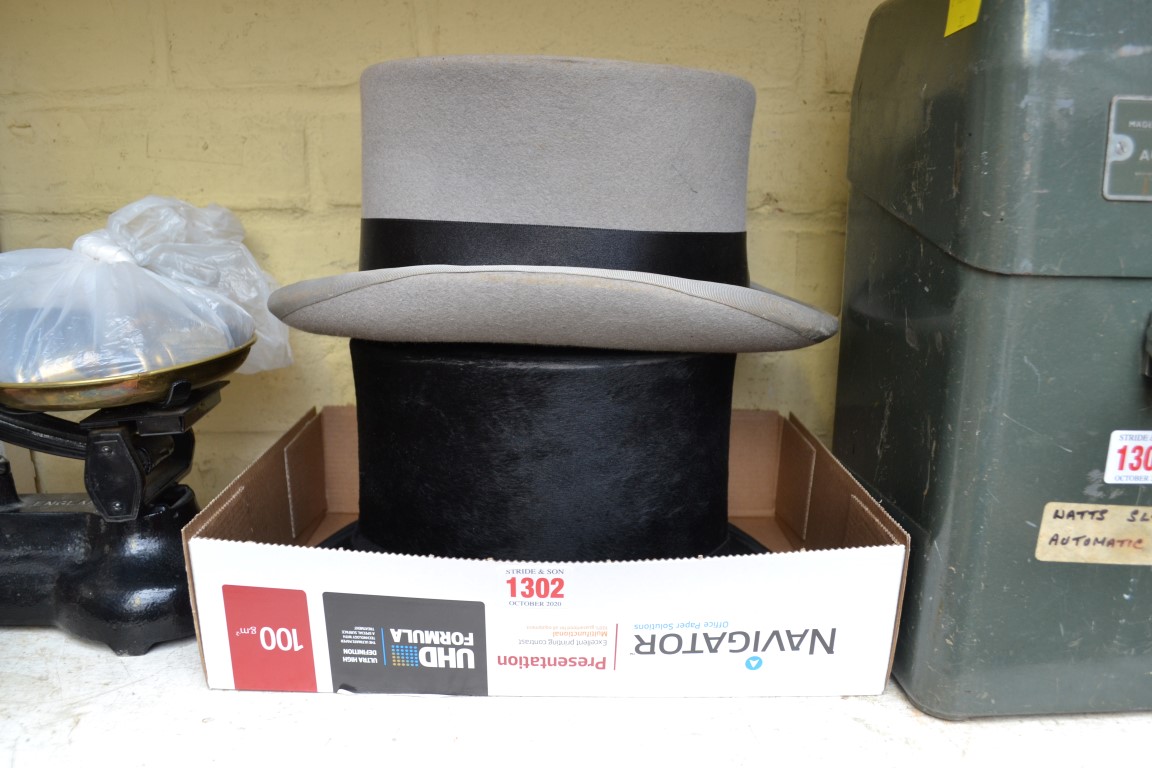 An old black felt top hat; together with a mourning hat.