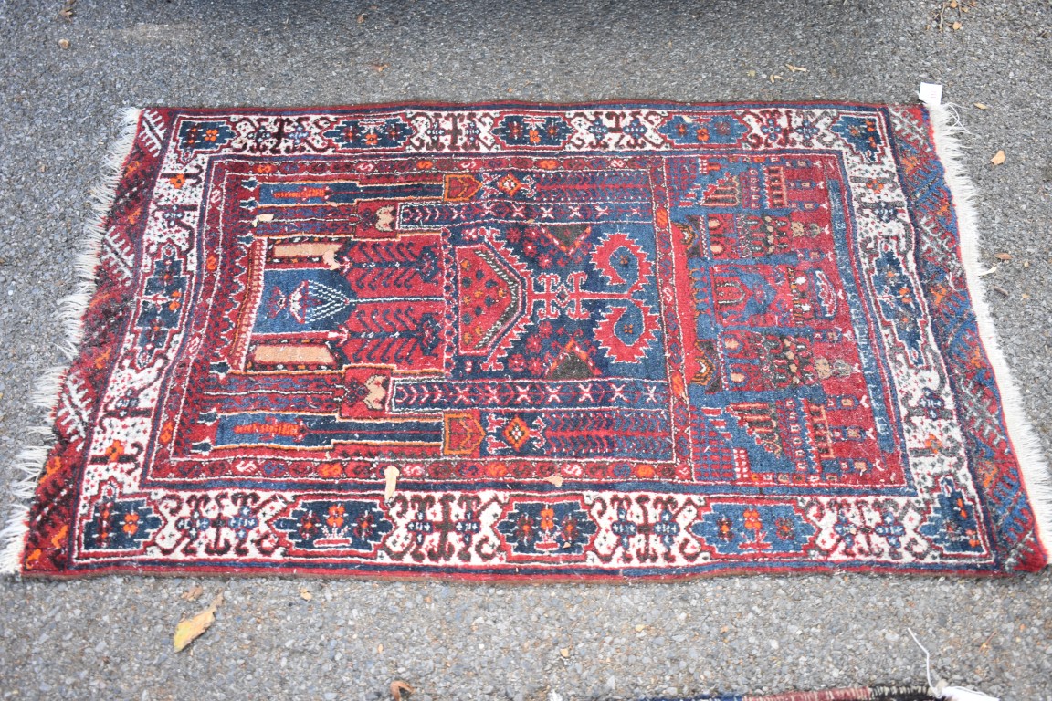 A Persian prayer rug, having temple to top, with geometric borders, 130 x 86cm.