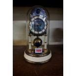 A vintage Kaiser 'Universe' 400 day anniversary clock, with glass dome, 25.5cm high.