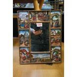An unusual reverse glass printed wall mirror, decorated with South American scenes, 32 x 26cm.