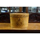 A George III satinwood and inlaid oval tea caddy, 16cm wide, with key.