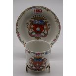A Chinese armorial cup and saucer, late 18th century, (hairline crack to saucer).