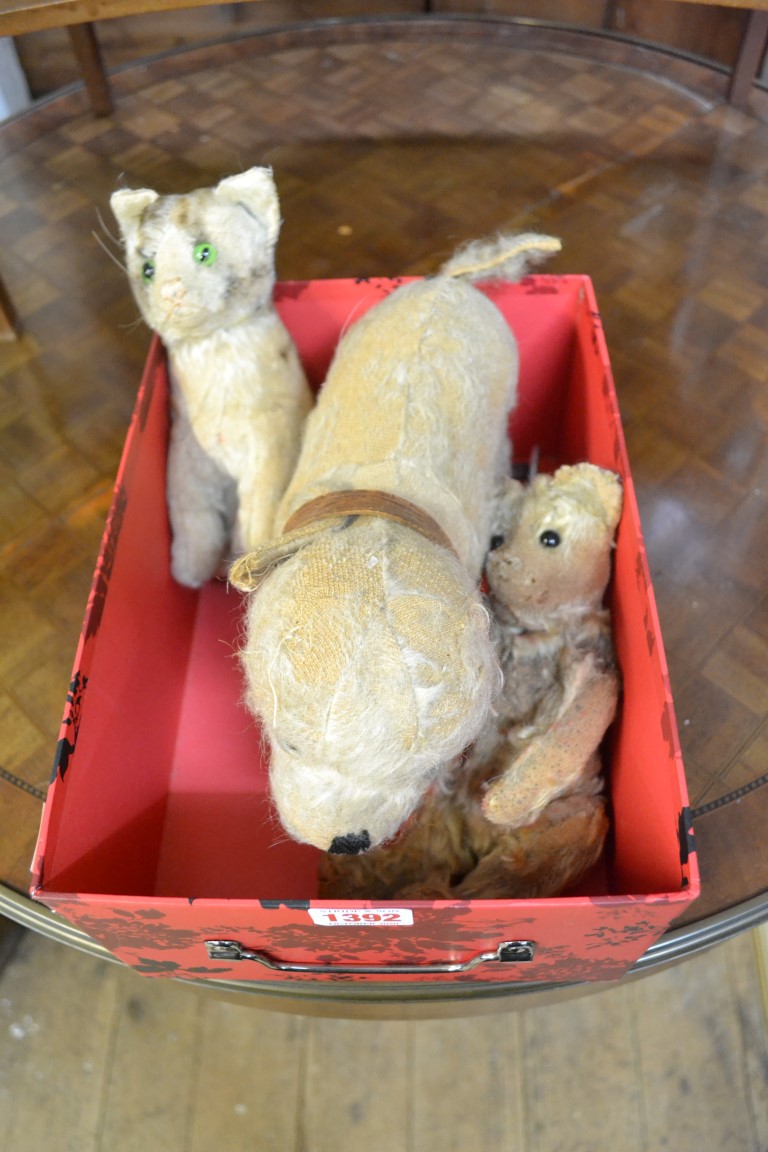 Three vintage plush toys, to include a pull along dog.