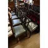 A set of eight antique mahogany dining chairs, each with green leather slip in seat.