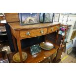 An early 19th century mahogany and line inlaid bow front side table, 106.5cm wide.