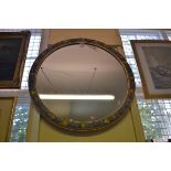 A large early 20th century barbola framed circular wall mirror, 61.5cm diameter.