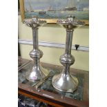 A large pair of electroplated ecclesiastical style candlesticks, 43cm high.