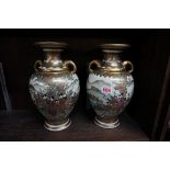 A pair of Japanese Satsuma twin handled vases, mark to base, 29.5cm high.