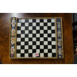 A rare 18th century French tin glazed faience chequer board, probably Rouen, with two lidded