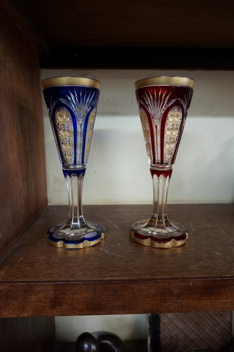 A pair of antique Bohemian flashed and gilt glass goblets, 24cm high.