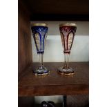 A pair of antique Bohemian flashed and gilt glass goblets, 24cm high.