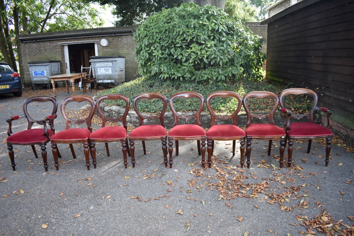 A set of eight antique mahogany button back dining chairs, to include a pair of carvers. This lot