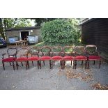 A set of eight antique mahogany button back dining chairs, to include a pair of carvers. This lot