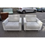 A pair of grey upholstered armchairs, by Avant Garde, Leroy, 100cm wide x 90cm deep. This lot can